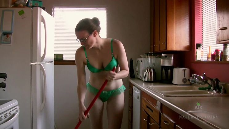 Jen cleans the kitchen